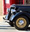Black shiny bonnet of a classic old vintage car
