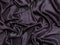 Black shiny silky fabric background