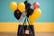 Black shopping bag paired with an array of vibrant, floating balloons