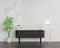 Black sideboard in living room with copy space, 3D rendering