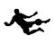 Black silhouette of a football goalkeeper in a sports T-shirt and gloves who jumped up to catch the ball in the goal