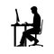 Black silhouette of a man sitting behind a computer icon