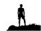 Black silhouette of man standing on the top of the hill, enjoying beautiful view.