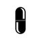 Black silhouette of medical vertical capsule, pills. Graphics ellipse shaped capsule with two halves on white background.