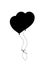 Black silhouette of pair bounded heart shaped helium balloons