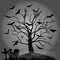 Black silhouette of a spooky tree with bats, gravestones, spiderwebs