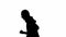 Black silhouette of thief on isolated white background. Male robber in hoodie and balaclava running. Concept of crime