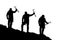 Black silhouette of three climbers with ice axe in hand