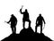 Black silhouette of three climbers with ice axe in hand