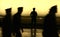 Black silhouette on wall background of a uniformed police officer