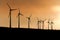 Black Silhouette of windturbines energy generator on amazing sunset at a wind farm in germany