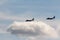 Black silhouettes flying Russian Tu-95 strategic bombers against the sky NATO reporting name: `Bear