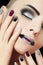 Black silver fashion glamorous manicure and makeup .