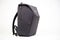 black sleek camera backpack, side profile on white