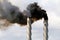 Black smoke emission from industrial chimney stacks