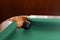 Black snooker ball by corner pocket