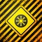 Black Snowflake icon isolated on yellow background. Warning sign. Vector