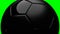 Black soccer ball on green chroma key background.