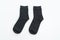 black sock on white background