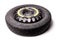 Black spare tire on a white isolated background in a photo studio with an aluminum disk and a rubber tire as a spare part in a car