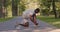 Black sportsman tying shoelaces on run path