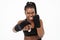 Black sportswoman wearing bandages boxing during workout