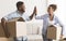 Black Spouses Giving High-Five Carrying Packed Boxes In New Apartment