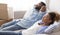 Black Spouses Resting Holding Hands Behind Head Sitting On Couch