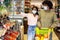 Black Spouses Shopping Groceries Wearing Masks Buying Food In Supermarket