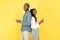 Black Spouses Using Phones Standing Back To Back, Yellow Background