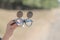 Black steampunk sunglasses with round lenses flip up retro model close up shoot in a summer day. Selective focus