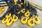 Black steel chain and yellow cargo hooks.