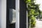 A black steel modern home fence with a plastic door bell and aluminium mail box.