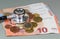 Black stethoscope, euro coins and banknotes