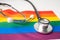 Black stethoscope on rainbow background, symbol of LGBT pride month  celebrate annual in June social, symbol of gay, lesbian, gay