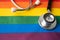 Black stethoscope on rainbow flag background, symbol of LGBT pride month  celebrate annual in June social, symbol of gay, lesbian