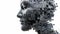 Black stone jigsaw puzzle sculpture in a human head shape.