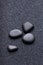 Black stones in a relaxing zen garden sand
