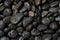 Black stones with water droplets, abstract background