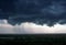 A black storm cloud above the city