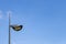 Black street lamp, lamppost, streetlight; with blue sky background