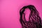 Black string eco shopping bag on pink background.