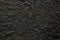 Black Stucco Wall Texture Background, Suitable for Wallpaper, Backdrop, Mockup, and Product Presentation.