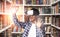 Black Student In VR Headset Standing In Library Indoors, Collage