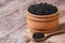 Black sturgeon caviar in a wooden a barrel