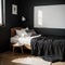 Black stylish loft bedroom Unmade bed with breakfast and reading on tray Lamp and interior decor over blank blackboard wall