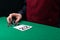 Black suit and chips for playing poker or blackjack, on the green table in front of the player, there is a place for the