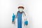 Black surgeon doctor man in white blue coat, gloves, white cap, surgeon mask makes attention gesture