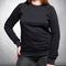 Black sweatshirt jacket with sleeves dressed on a girl on a gray background. Vertical orientation