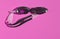 Black Swimming goggles, white lines On a pink background, morning sunlight, athletes, eye protection,